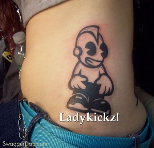 This chick got the Kidrobot tattoo on her side. Crazy.